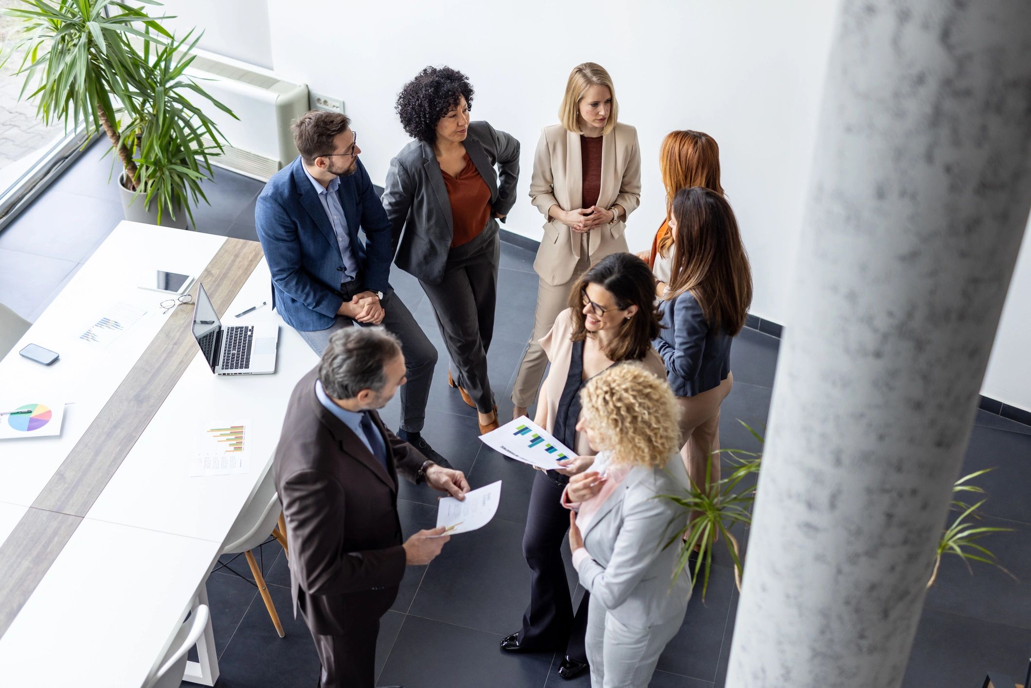 Executive team gathered around a conference table