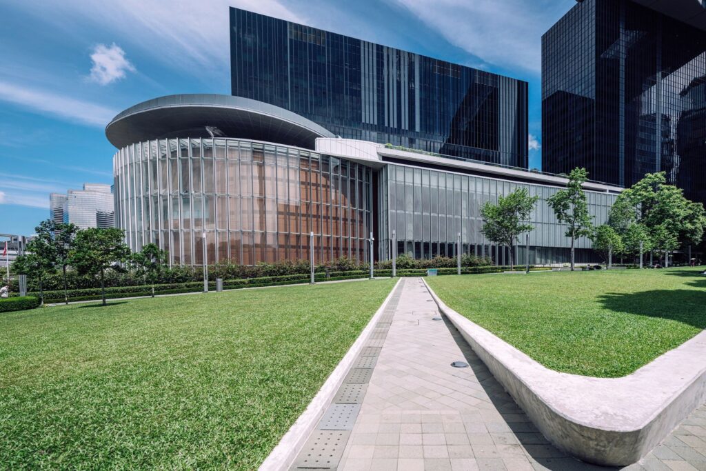 Modern Hong Kong Waterfront With Skyscrapers and Lawn